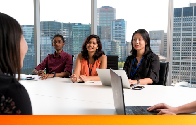 Three international students working at an office in an Adelaide business